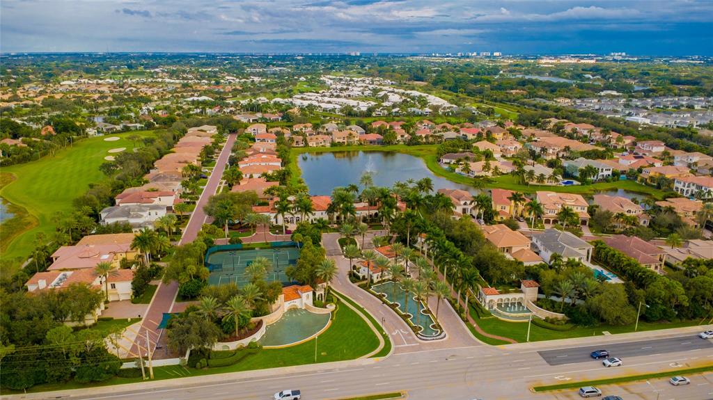 6359 Bellamalfi Street Boca Raton, FL 33496 - Photo 67 of 86 an aerial view of residential houses with outdoor space and trees