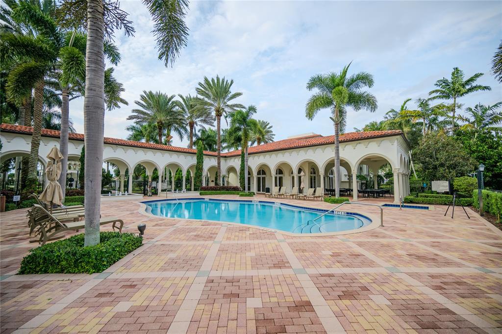 6359 Bellamalfi Street Boca Raton, FL 33496 - Photo 80 of 86 a view of a swimming pool with a patio