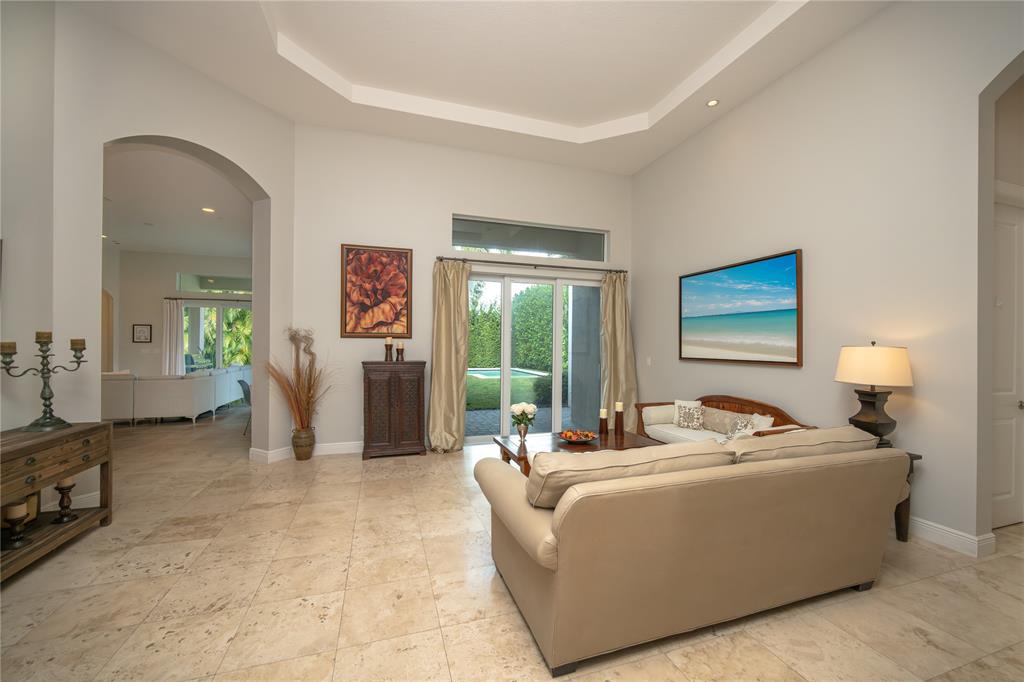 6359 Bellamalfi Street Boca Raton, FL 33496 - Photo 10 of 86 a living room with furniture and a window