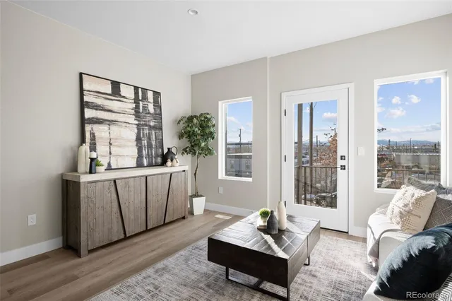 a living room with furniture and windows