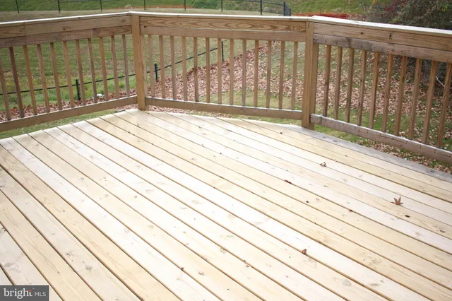 a view of wooden balcony with wooden floor