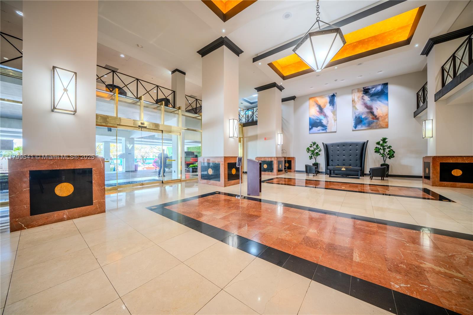 555 Northeast 15th Street, Unit 508 Miami, FL 33132 - Photo 22 of 25 a view of a living room with stainless steel appliances furniture a fireplace and a floor to ceiling window