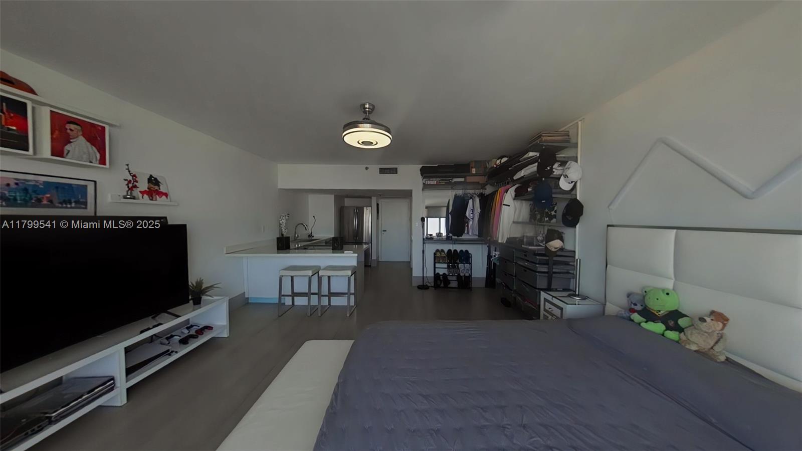 555 Northeast 15th Street, Unit 508 Miami, FL 33132 - Photo 7 of 25 a living room with furniture and a flat screen tv