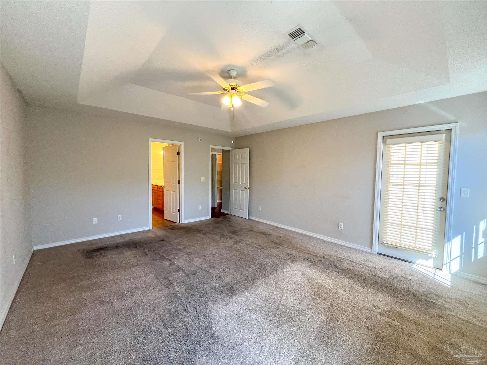 2967 Creole Way Pensacola, FL 32526 - Photo 14 of 30 wooden floor in an empty room with a window