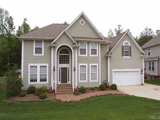 5140 Bartons Enclave Lane Raleigh, NC 27613 - Photo 1 of 1 a front view of a house with a yard and garage