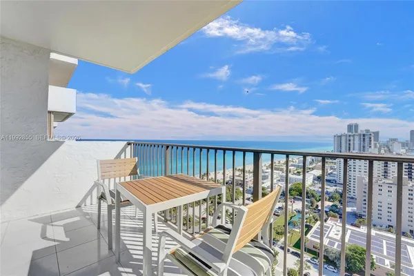 a view of a balcony with furniture