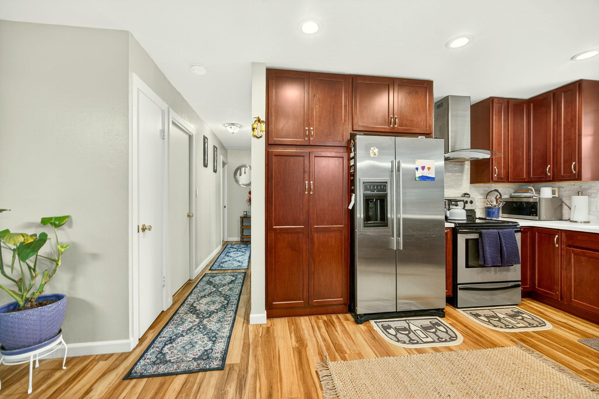 659 Herman Avenue Medford, OR 97501 - Photo 30 of 42 a kitchen with granite countertop stainless steel appliances a refrigerator and a stove top oven