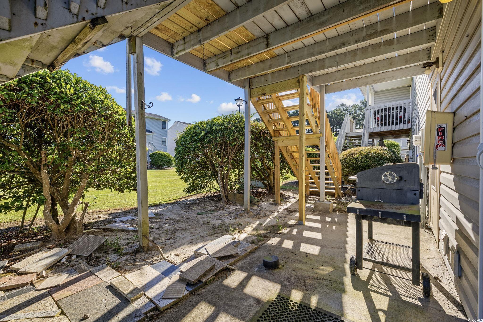 801 Burcale Road, Unit I1 Myrtle Beach, SC 29579 - Photo 19 of 27 View of patio / terrace featuring grilling area and stairs