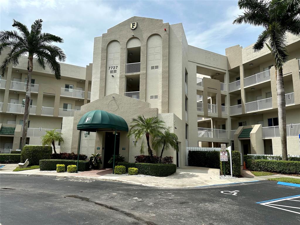 7727 Southampton Terrace, Unit 303 Tamarac, FL 33321 - Photo 1 of 23 a front view of a building with street