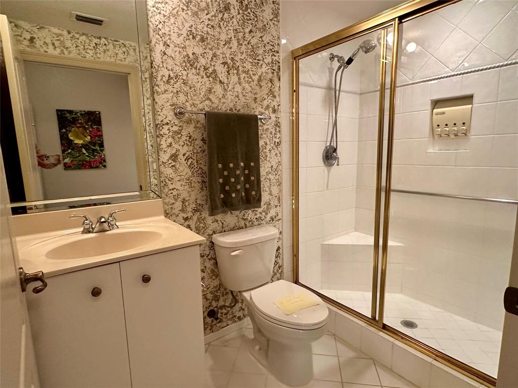 7727 Southampton Terrace, Unit 303 Tamarac, FL 33321 - Photo 12 of 23 a bathroom with a sink toilet and shower