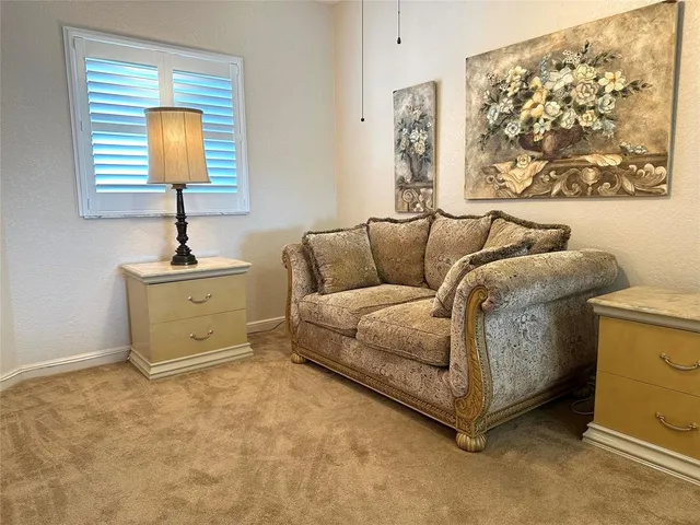 a living room with a couch and a window