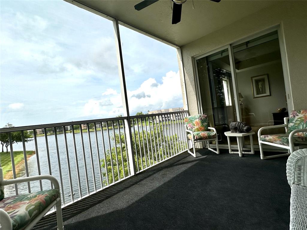 7727 Southampton Terrace, Unit 303 Tamarac, FL 33321 - Photo 4 of 23 a view of a porch with furniture
