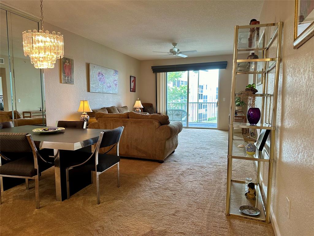 7727 Southampton Terrace, Unit 303 Tamarac, FL 33321 - Photo 6 of 23 a view of a livingroom with furniture and window