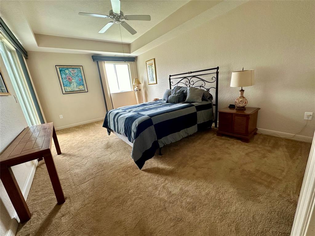 7727 Southampton Terrace, Unit 303 Tamarac, FL 33321 - Photo 8 of 23 a bedroom with a bed and window