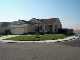597 Anderson Way Rio Vista, CA 94571 - Photo 1 of 6 a front view of a house with a garden
