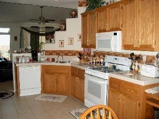 597 Anderson Way Rio Vista, CA 94571 - Photo 2 of 6 a kitchen with a sink stove and cabinets