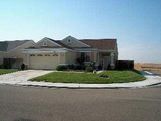 597 Anderson Way Rio Vista, CA 94571 - Photo 6 of 6 a front view of a house with a garden