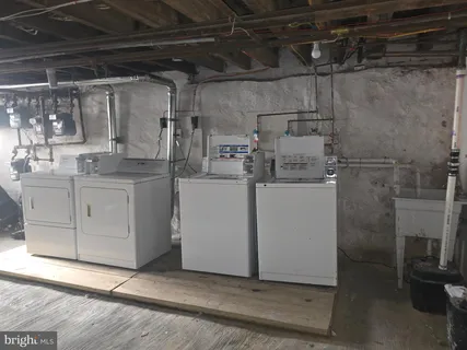 a kitchen with a sink cabinets and window