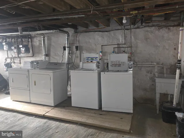 a kitchen with a sink cabinets and window