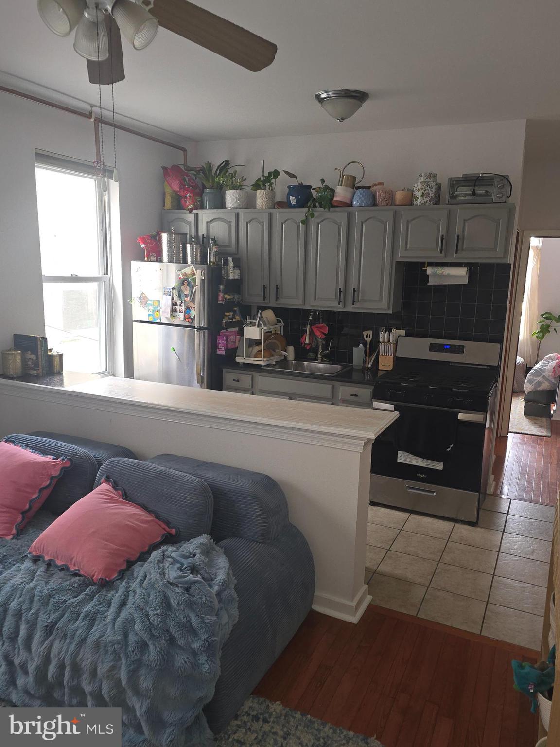 1523 Christian Street, Unit 2R Philadelphia, PA 19146 - Photo 12 of 18 a kitchen with a sink cabinets and window