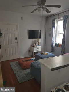 a kitchen with a sink appliances and cabinets