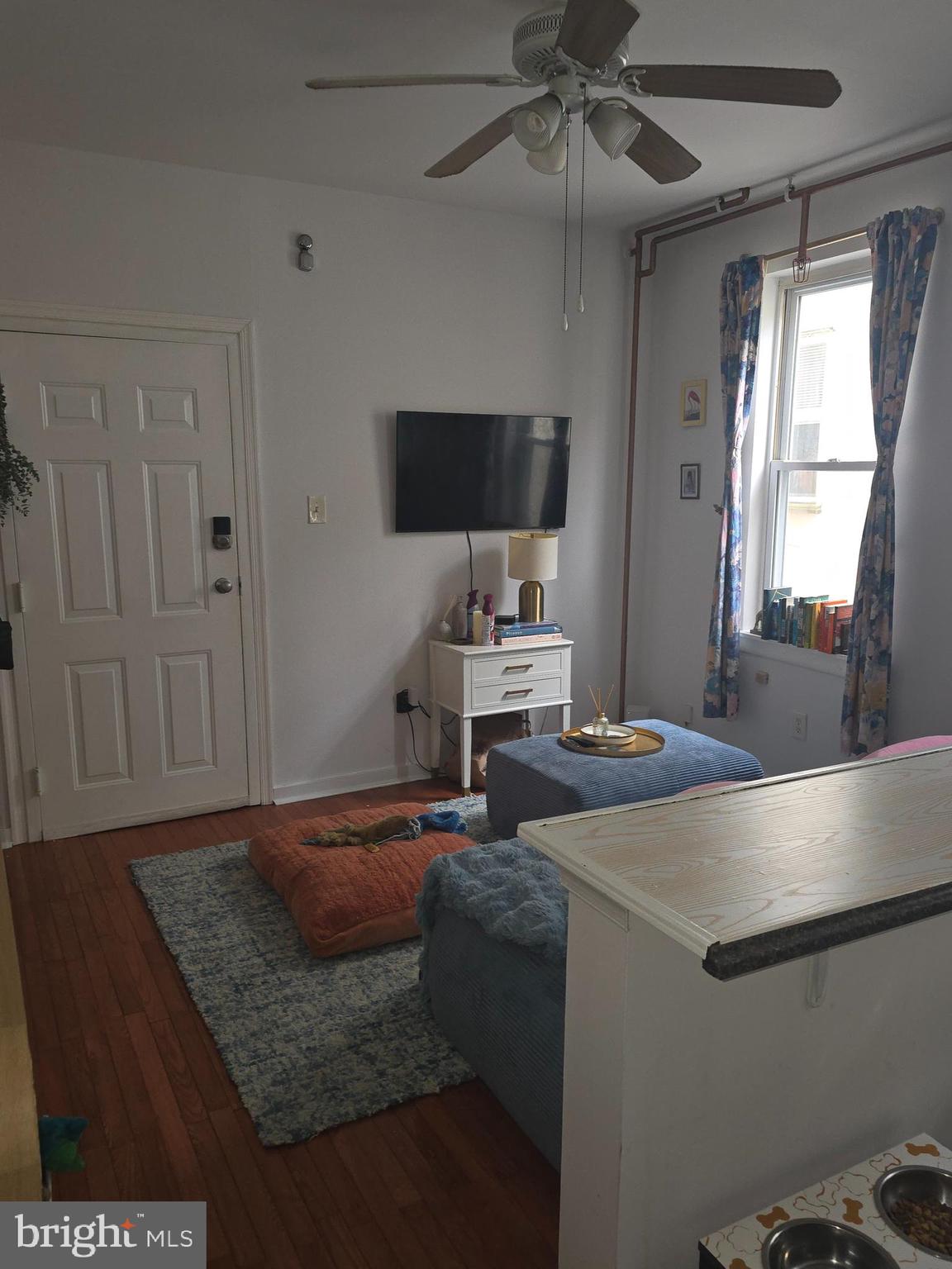 1523 Christian Street, Unit 2R Philadelphia, PA 19146 - Photo 17 of 18 a bedroom with a bed and a flat screen tv