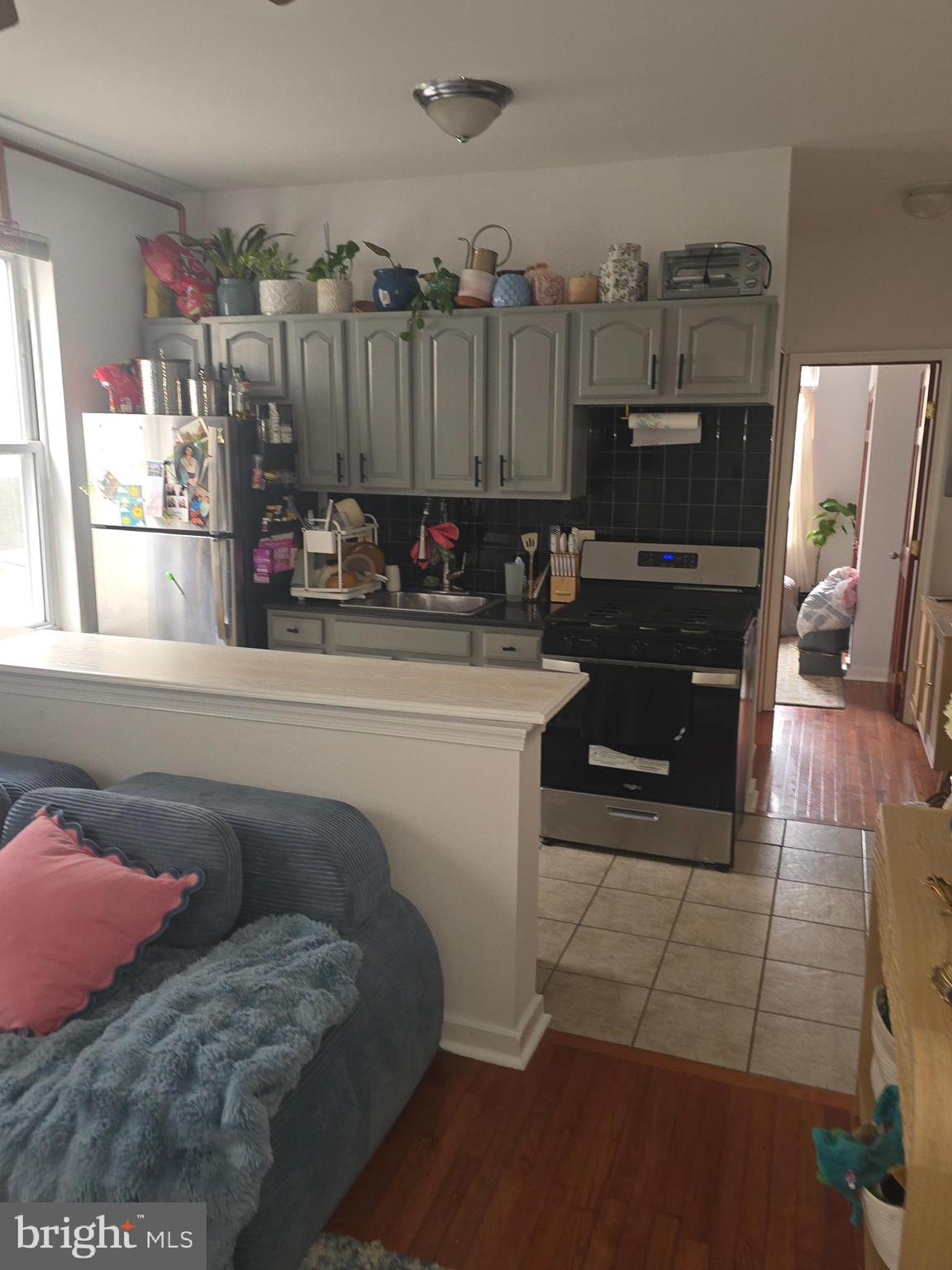 1523 Christian Street, Unit 2R Philadelphia, PA 19146 - Photo 18 of 18 a kitchen with a sink appliances and cabinets