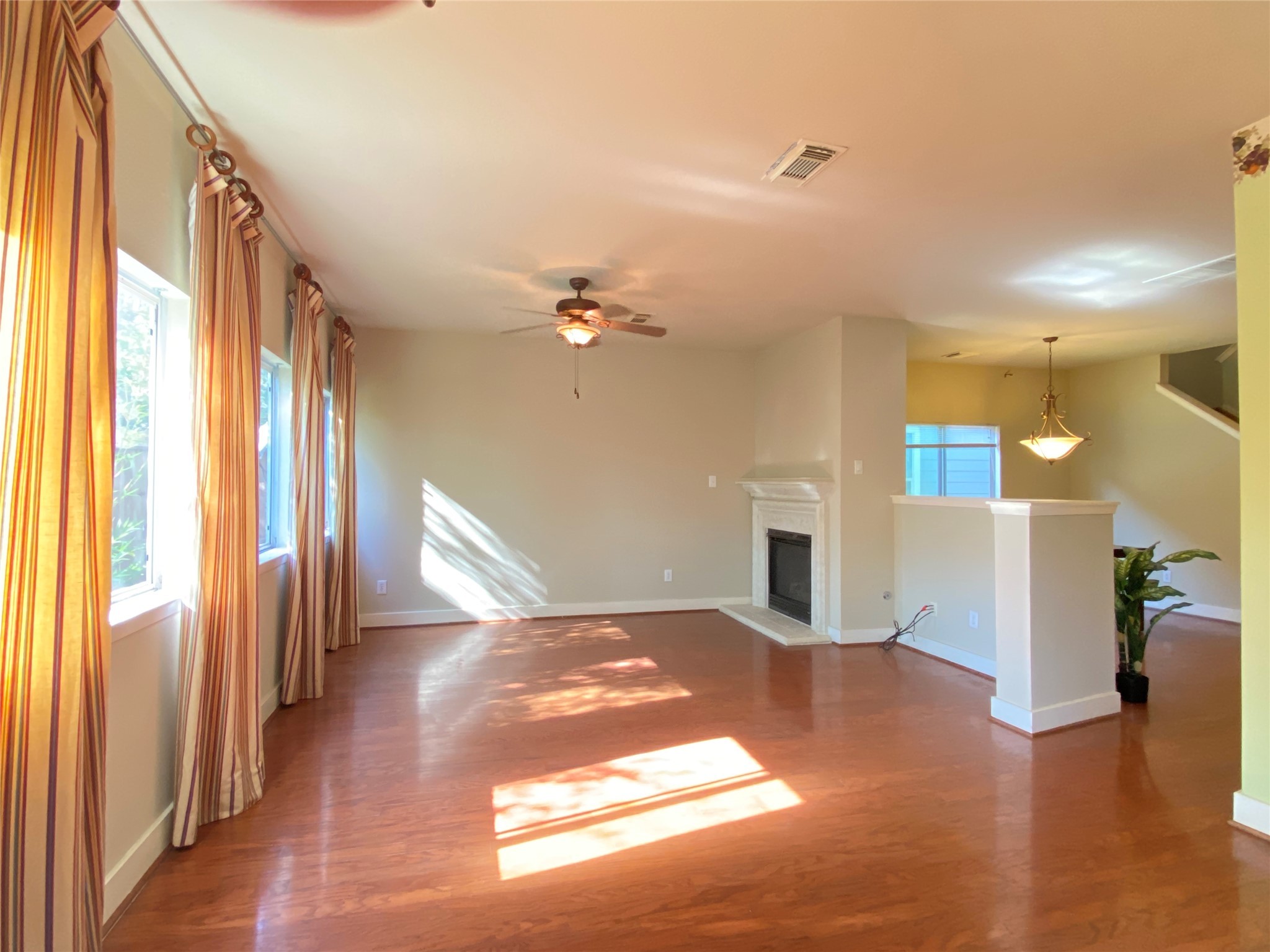 5843 Sonoma Ridge Missouri City, TX 77459 - Photo 8 of 20 a view of a livingroom with wooden floor and a kitchen