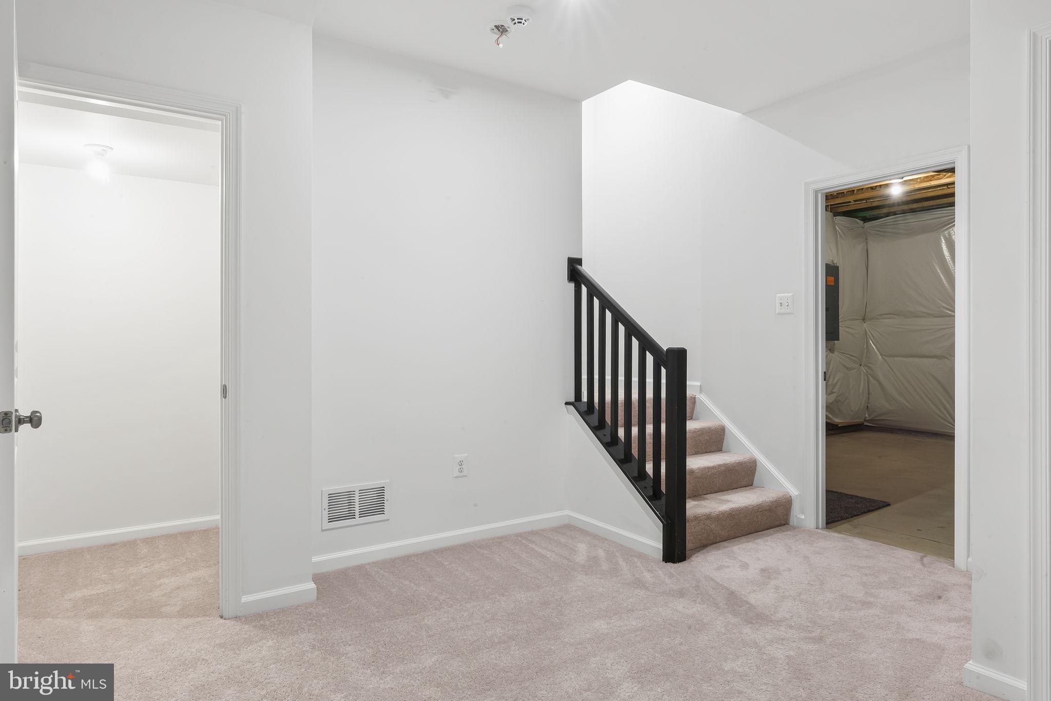 18270 Moss Garden Road Dumfries, VA 22026 - Photo 68 of 85 Hallway to recreation room and storage space