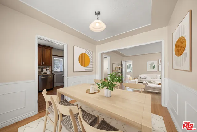 a view of a dining room with furniture and chandelier