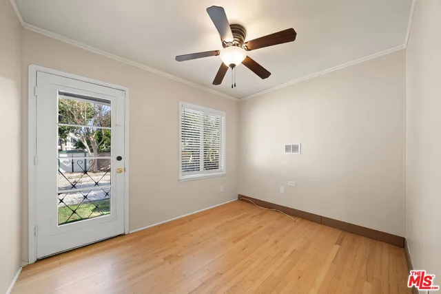 a view of room with window and ceiling fan
