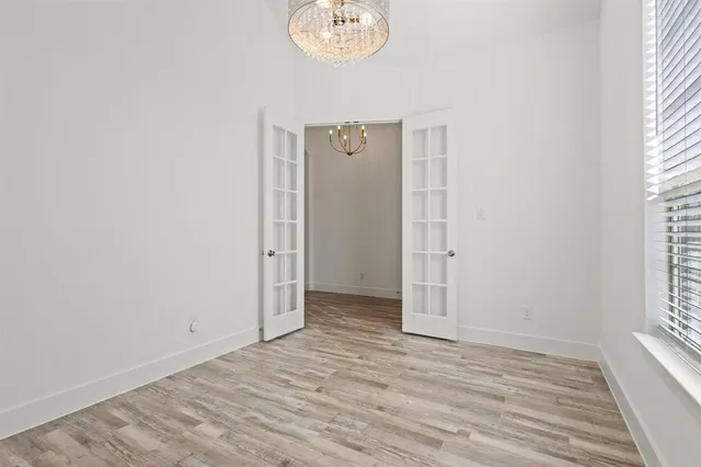 an empty room with window and windows