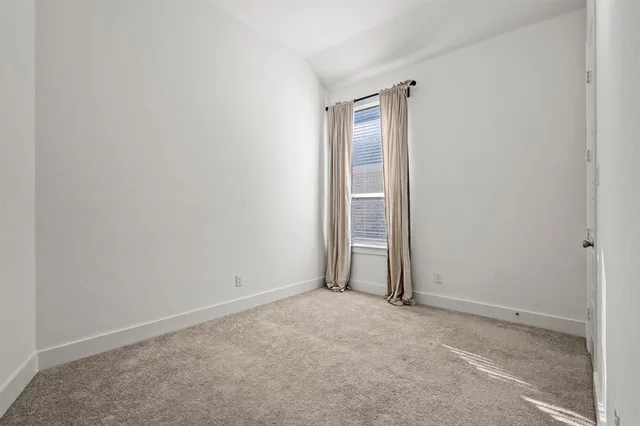 an empty room with closet area