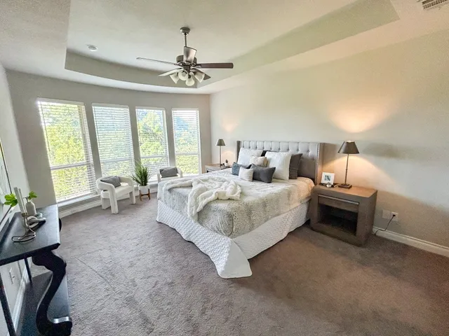 a bed room with a bed and a chandelier