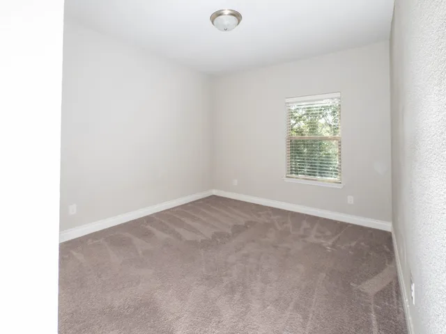 a view of a patio with couches table and chairs and potted plants
