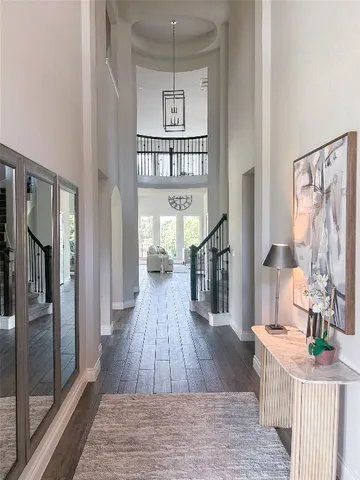a very nice looking living room with a large window and wooden floor
