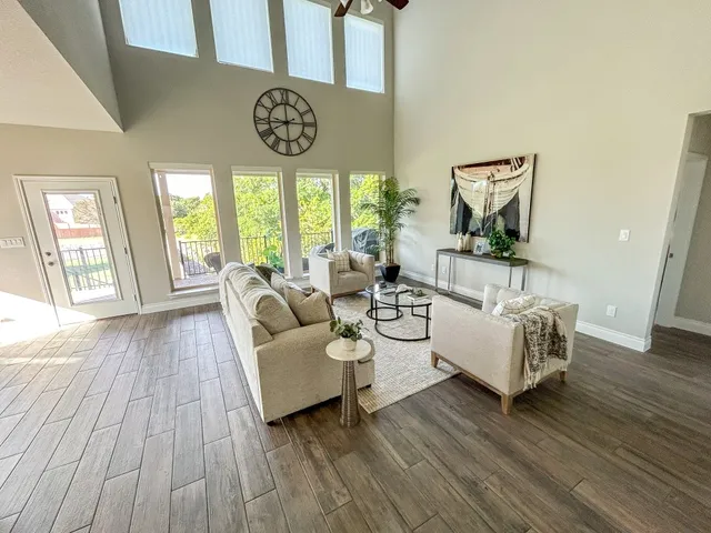 a living room with furniture and a large window