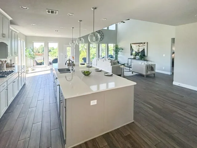 a view of kitchen with sink and living room