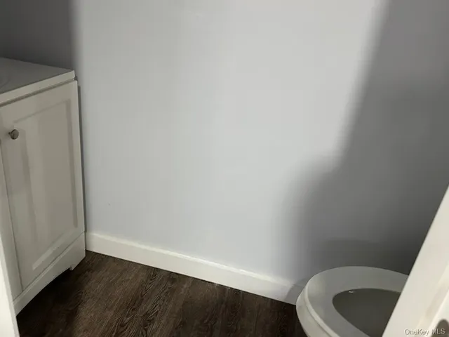 a utility room with cabinets washer and dryer