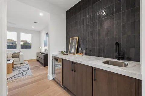 a kitchen with cabinets appliances and a sink