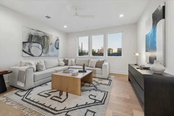 a view of a living room with a wooden floor