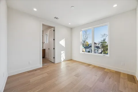 a view of a living room with a wooden floor