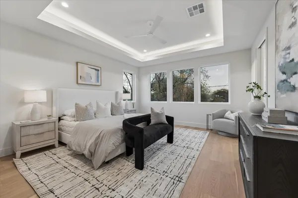 a living room with furniture kitchen and a table