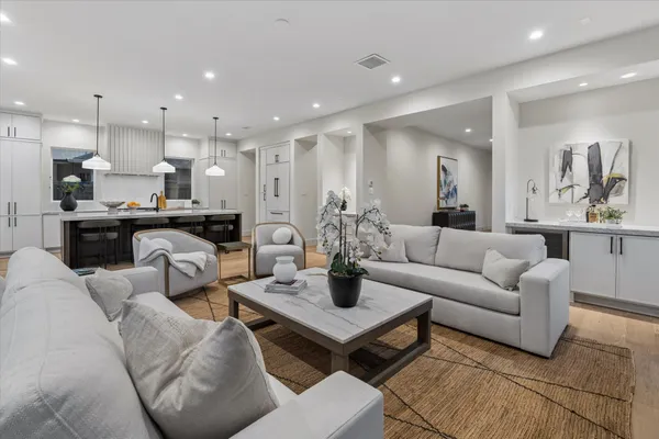 a kitchen with stainless steel appliances granite countertop a stove and a sink