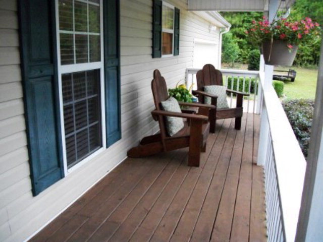 103 Craig Road Forsyth, GA 31029 - Photo 11 of 13 a view of a deck with table and chairs and potted plants