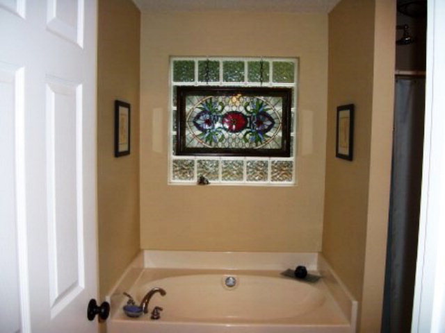 103 Craig Road Forsyth, GA 31029 - Photo 7 of 13 a bathroom with a bathtub