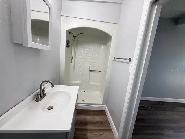 a bathroom with a sink and mirror