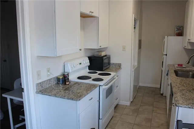 a kitchen with a stove and a sink
