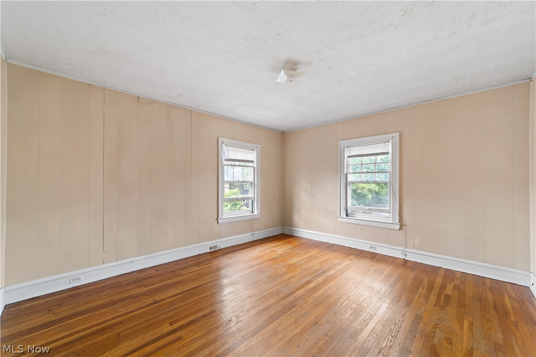 3076 Yorkshire Road Cleveland, OH 44118 - Photo 37 of 47 Empty room featuring hardwood / wood-style flooring and a textured ceiling