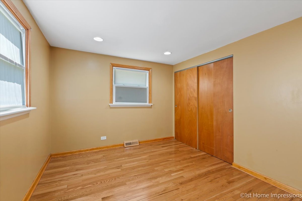 16640 Marshfield Avenue Markham, IL 60428 - Photo 11 of 20 a view of an empty room with wooden floor and a window